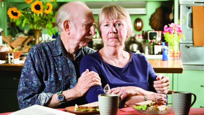 Portrait of Worried Senior Couple Portrait of Worried Senior Couple in their Dining Room