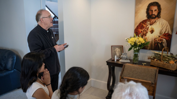 Father Ashbaugh enthrones Sacred Heart 
