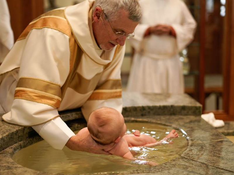 deacon baptizing baby