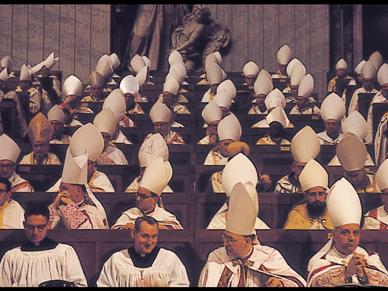Father Mengeling assisting bishops during Vatican II. He served as a page during council sessions.